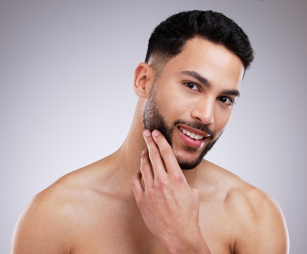 portrait of happy man in studio with natural, beauty and face routine
