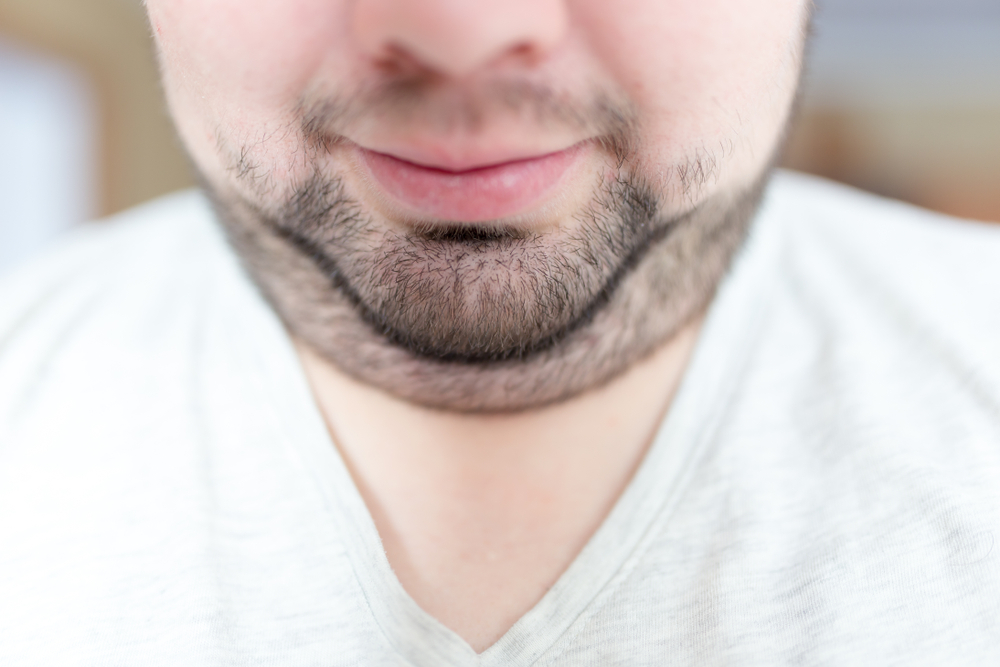 Man looking down to show double chin