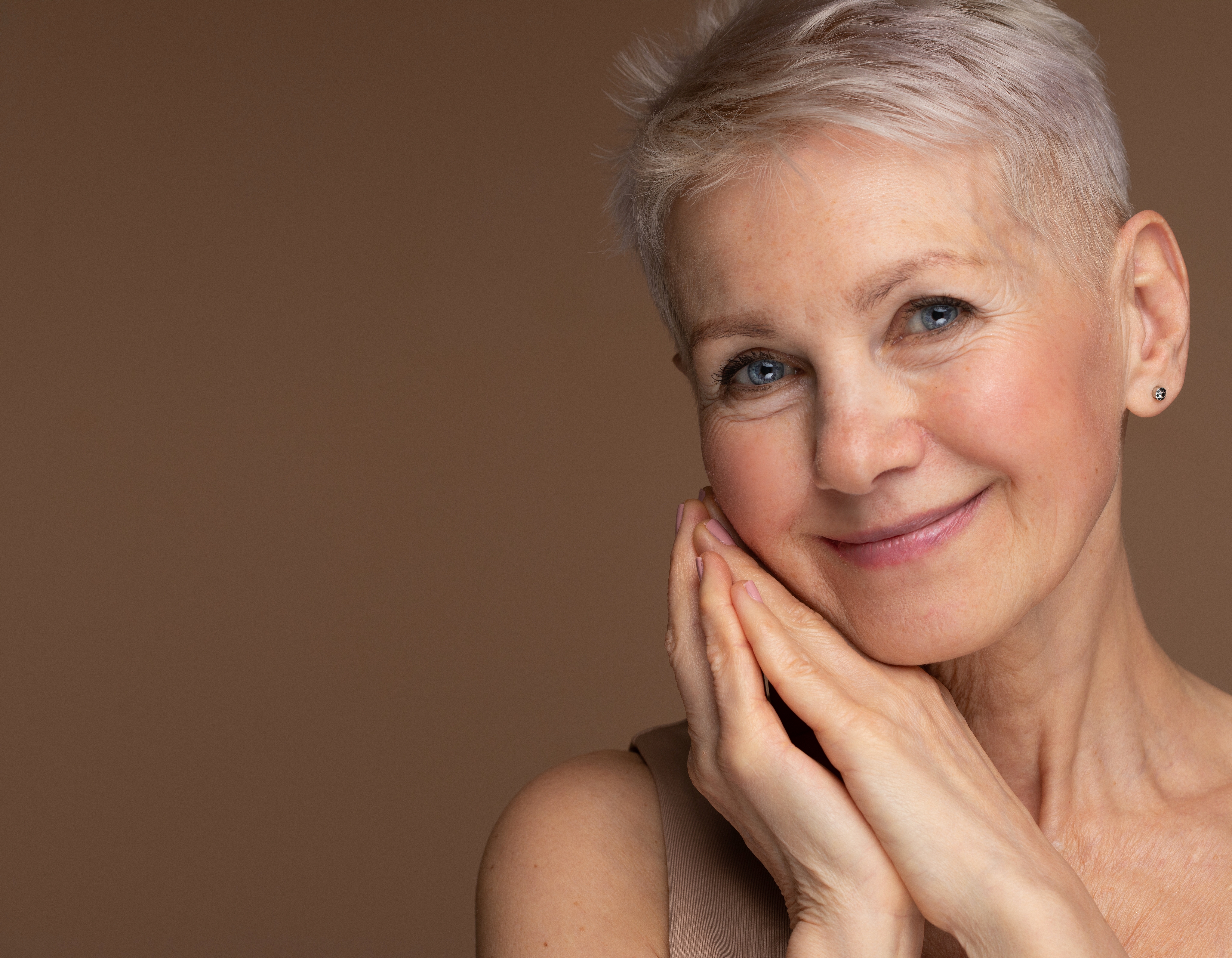 older woman showing reduced wrinkles from botox treatment
